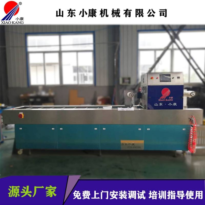 麻辣无骨鸡爪连续气调锁鲜封盒机-小康牌连续盒式包装机